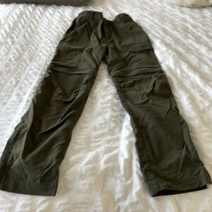 Kids Olive REI hiking pants with detachable lower bottoms to make into shorts